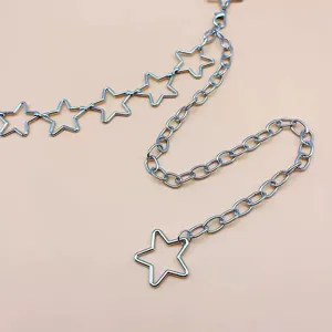 Metal star chain detail view, vintage hollow pentagram body jewelry design, silver accessory.