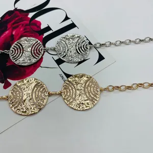 Exquisite metal waist chain with cutout round design, trendy body jewelry for women.
