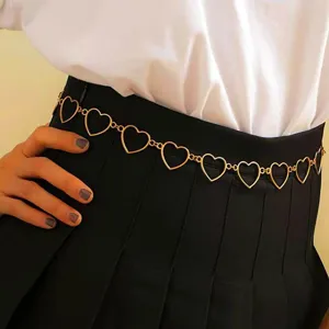 Gold heart chain belt for women, retro metal waist chain, fashion body jewelry accessory.