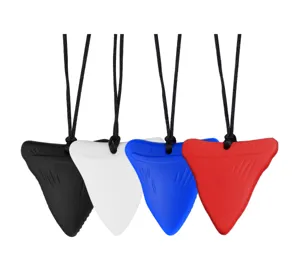 Silicone shark tooth chew necklace detail view showing multi-color sensory molar options.