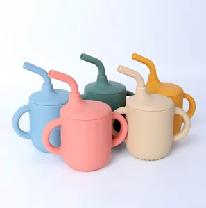 Silicone baby sippy cup detail view, featuring dual handles and soft straw in various pastel colors.