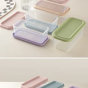 Transparent plastic food storage box set with colorful lids for kitchen meal prep lunch.