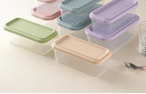 Transparent plastic food storage container set with colorful silicone lids for kitchen.