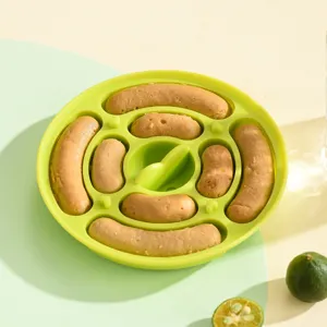 Green silicone sausage mold with homemade baby food sausages on table, main product view
