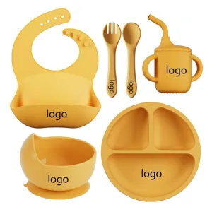 Silicone baby feeding set with 6 pieces including bib plate bowl cup spoon fork for toddlers.