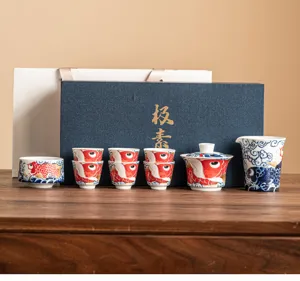 Traditional Chinese Kung Fu ceramic tea set with vibrant koi fish pattern and elegant gift box.