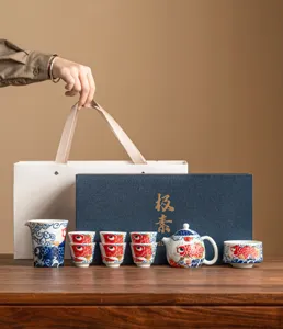 Ceramic kung fu tea set with koi fish pattern, teapot and cups gift box set for home use.