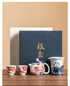 Elegant ceramic kung fu tea set with teapot and teacups in a gift box for home guests.