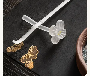 Frosted glass plum blossom tea pick and pillow set, elegant kung fu tea ceremony accessory.