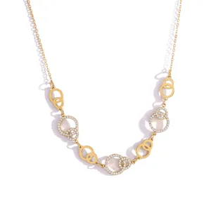 Gold rhinestone interlocking circle chain necklace detail, elegant luxury jewelry design.