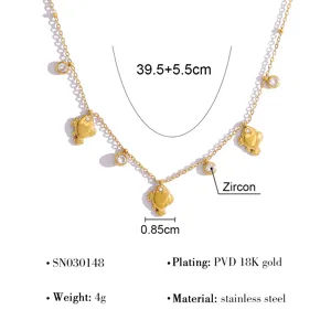 Detailed view of gold stainless steel necklace with sparkling zircon and cute heart pendants.