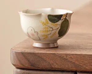 Hand-painted ceramic tea cup with cute rabbit and floral pattern, perfect for kung fu tea tasting.