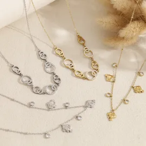 Close-up of elegant rhinestone interlocking circle and charm necklaces, perfect detailed jewelry.