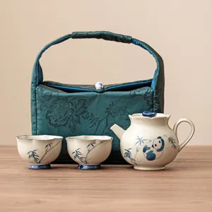 Portable ceramic kung fu tea set with teapot, two cups and green storage bag, panda bamboo pattern