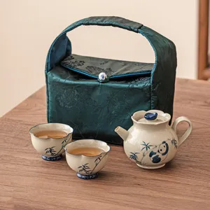 Portable ceramic travel tea set with cute panda bamboo pattern for one person outdoor use.
