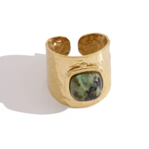 Wide open ring with hammered gold finish and square green natural stone centerpiece.