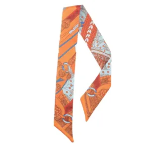 Chic orange silk twilly scarf with classic equestrian chain pattern for bags and hair styling.