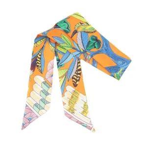 Orange tropical bird silk twilly scarf, elegant handbag ribbon and hair band accessory.