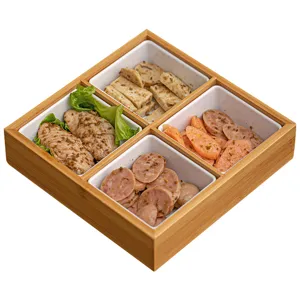 Bamboo grid serving tray with ceramic bowls for hotpot and snacks, natural kitchenware.