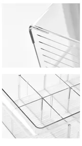 Detail view of clear plastic drawer organizer box with internal dividers for socks and underwear.