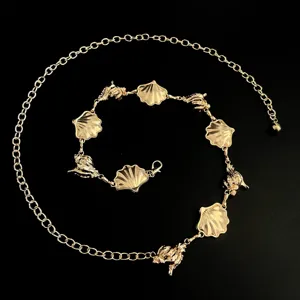 Gold shell waist chain detail, metal body chain jewelry for women beach dress summer fashion.