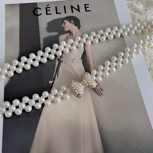 Elegant pearl waist chain with rhinestone bow, retro elastic belt for dresses and skirts.