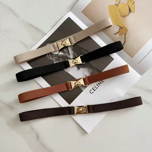 Elastic waist belt for women, skinny stretch dress belt with gold metal twist lock buckle.