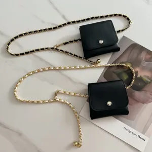 Chic black and white mini pouch waist bag with woven leather metal chain detail for women.