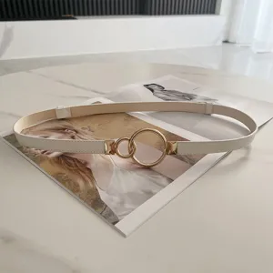 Women's slim white belt with gold double ring buckle, elegant versatile dress waist accessory.