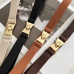 Elastic thin waist belt set featuring gold tone metal twist lock buckles in four colors.