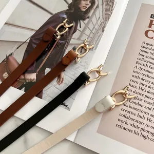 Cintura sottile in pelle da donna con fibbia dorata, accessorio da vita versatile per vestiti.