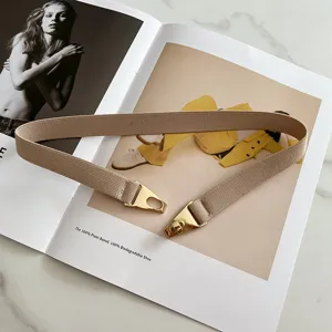 Elastic waist belt for women, versatile skinny belt with gold metal buckle for dresses.