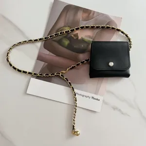 Women's mini bag waist belt with woven leather metal chain, trendy chic black fashion accessory.
