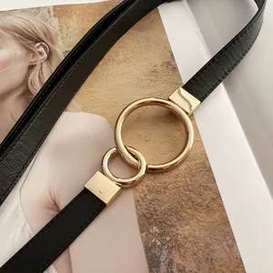 Adjustable thin belt detail showing the elegant double gold ring buckle and black matte texture.