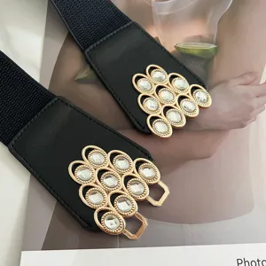 Black elastic waist belt with stunning crystal rhinestone metal buckle, elegant detail view.