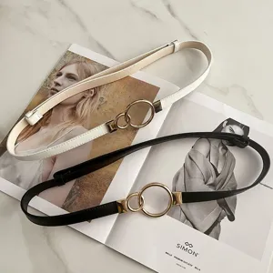 Details of the women thin belt with double ring metal buckle, stylish dress accessory.