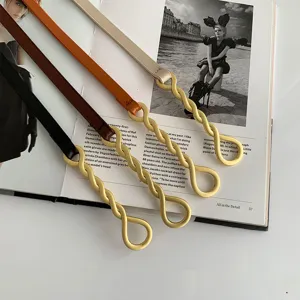 Ceinture fine pour femme avec boucle en métal torsadé doré, élégante lanière en cuir PU.
