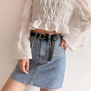 Stylish women's black belt with metal ring buckle, perfect daily accessory for denim skirts.