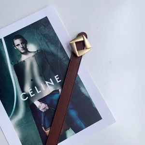 Detail of brown leather belt with geometric diamond buckle, ideal for daily casual outfits.