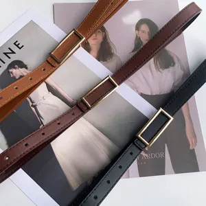Minimalist women's thin belt with rectangular metal buckle, stylish daily jeans accessory.