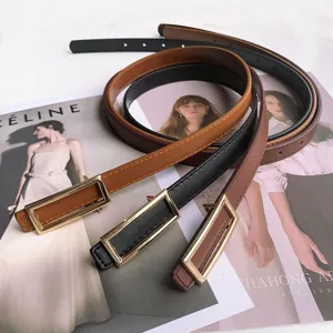 Minimalist women thin belt with metallic rectangular buckle, elegant black and brown leather design.