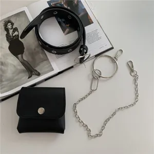 Punk style women black leather belt with chain and pouch for stylish skirts detail view.