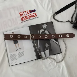Women brown PU leather belt with metal eyelets and punk chain accessory for fashion daily outfit.