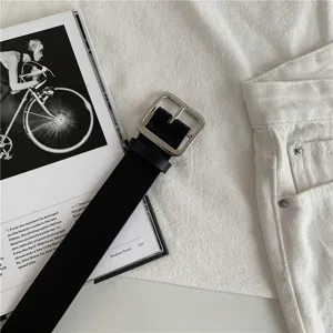 Minimalist black leather belt with a sleek silver square buckle, perfect for everyday style.
