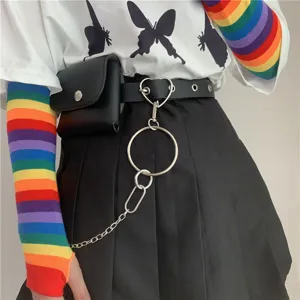 Punk style women decorative belt close up showing heart ring and small pouch with chain accessories