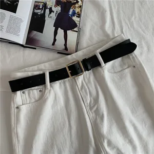 Women casual leather belt with chic square metal buckle, stylish black waist accessory detail.