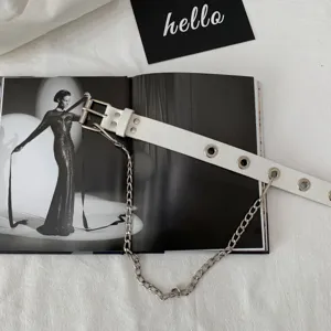 Women white punk leather belt with metal eyelets and chain detail, trendy waist accessory