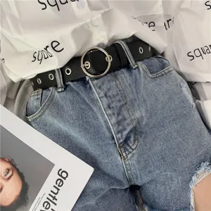 Stylish women's black leather belt featuring a classic round metal buckle, casual accessory.