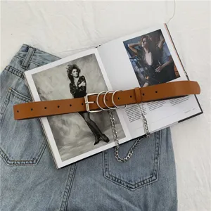 Punk style brown leather belt for women with metal chain and rings, perfect jeans accessory.