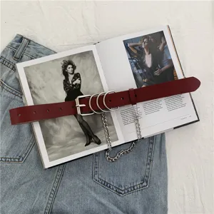 Punk style wine red leather belt with metal O-rings and chain detail for women jeans.